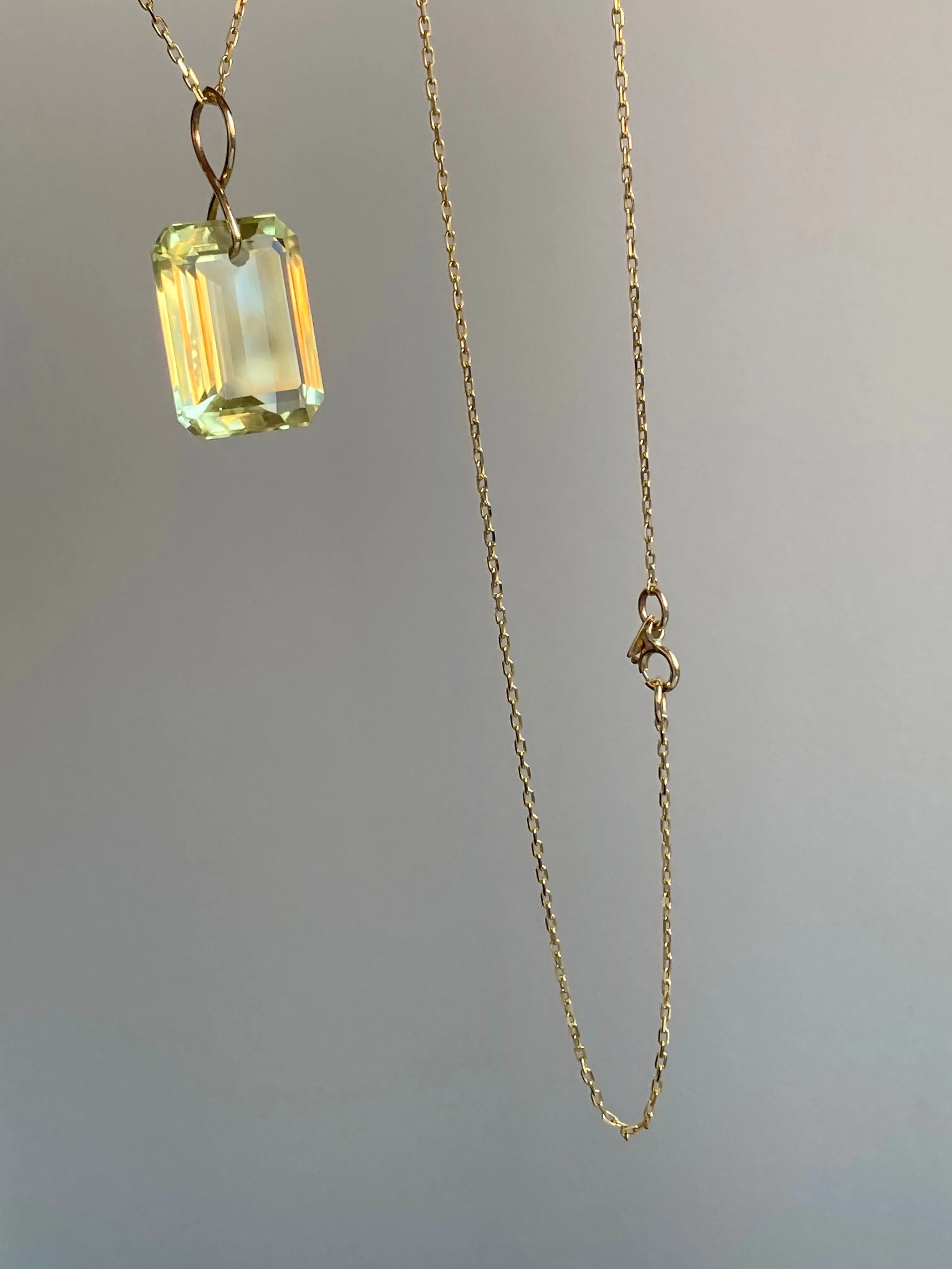 Emerald Cut Citrine on a 14k yellow gold infinity bale