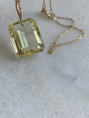 Emerald Cut Citrine on a 14k yellow gold infinity bale